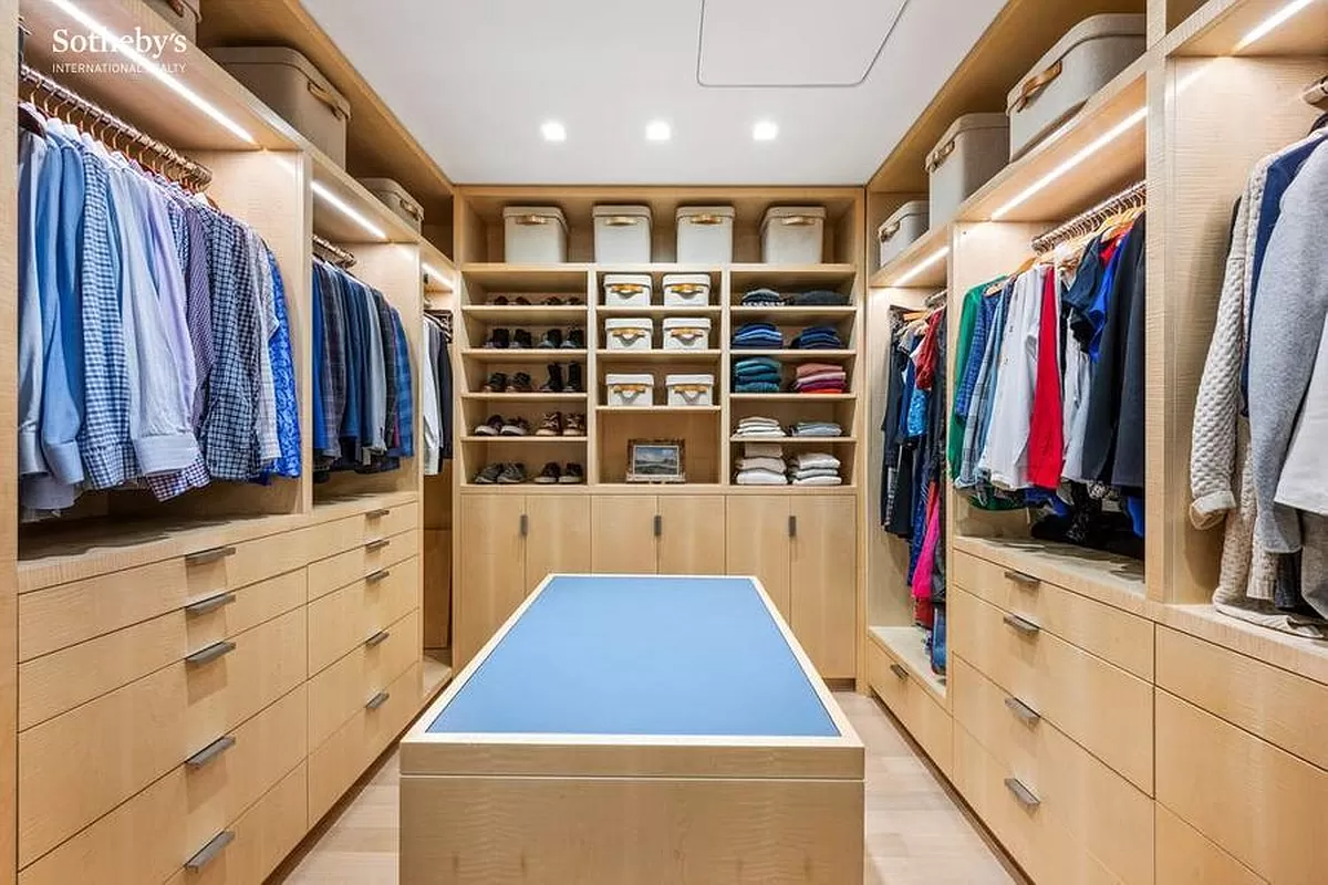 dressing room with center island and built-in storage