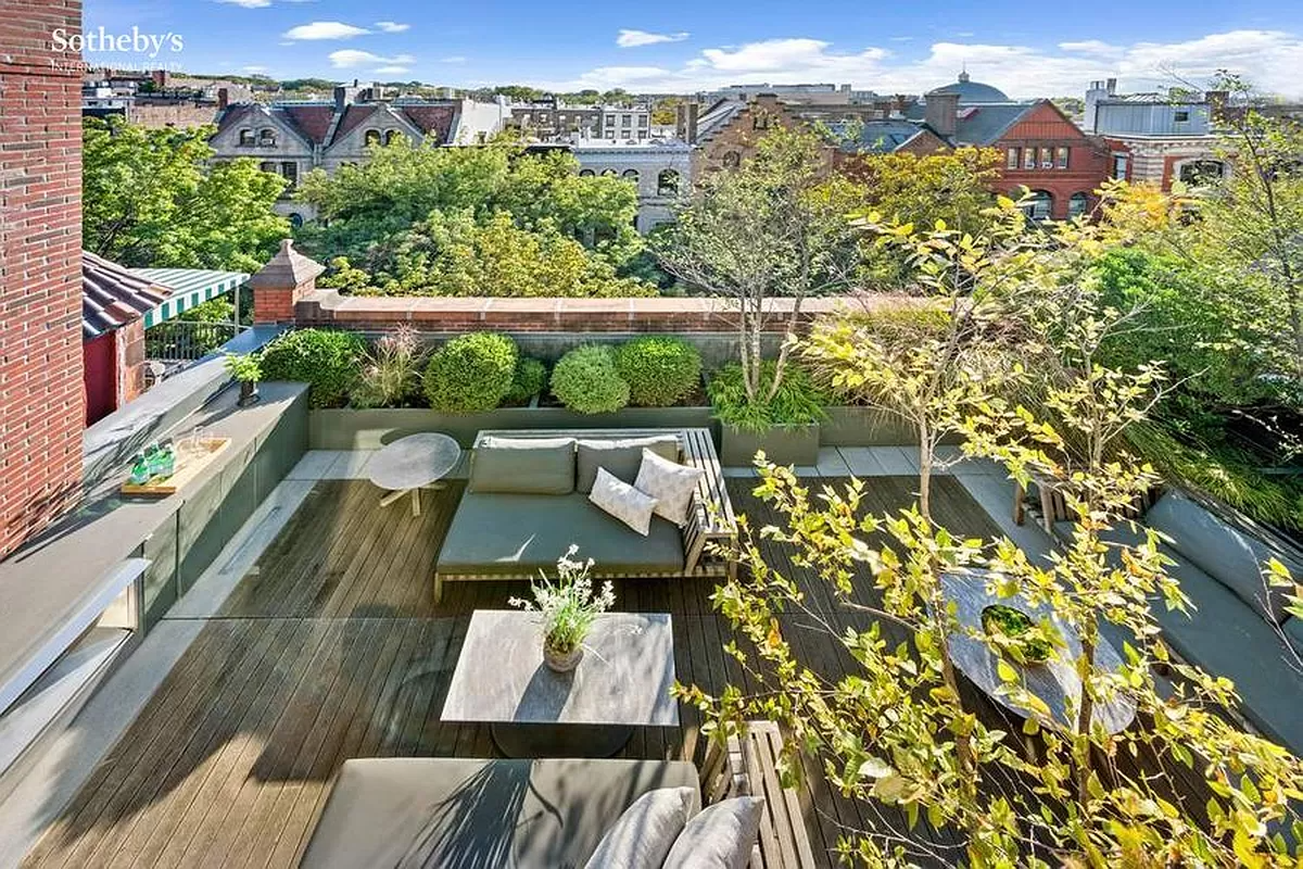 aerial view of terrace showing plantings and furniture and fireplace