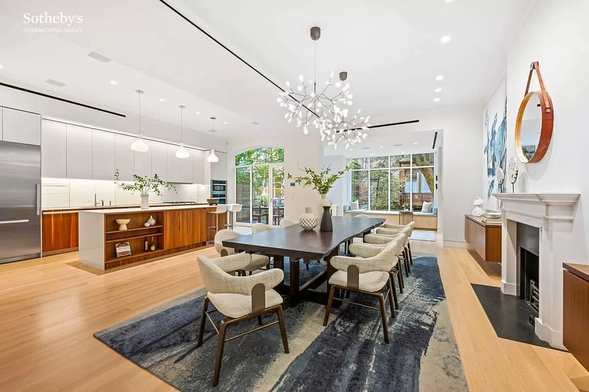 dining area with mantel and open to the kitchen