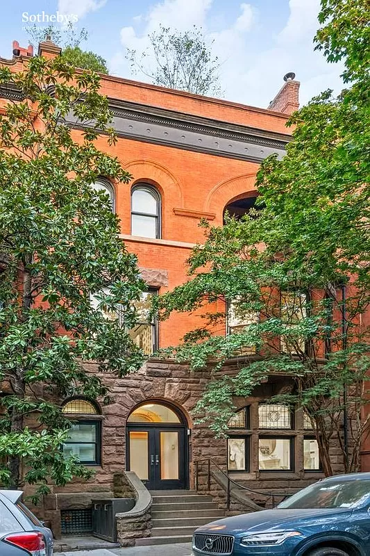 exterior with brick upper floors and stone lower