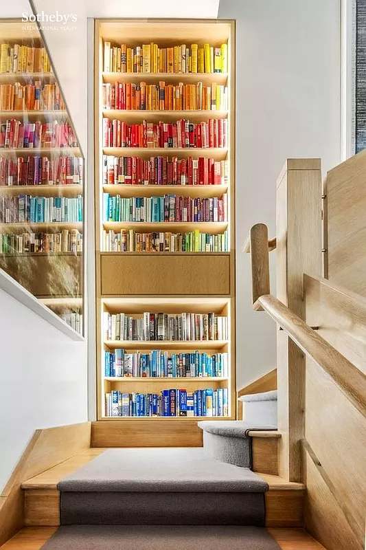 built-in bookshelves on the stair landing