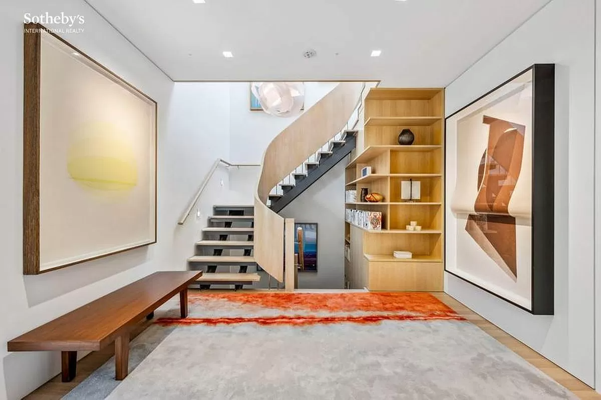 stair landing with built-in bookshelves