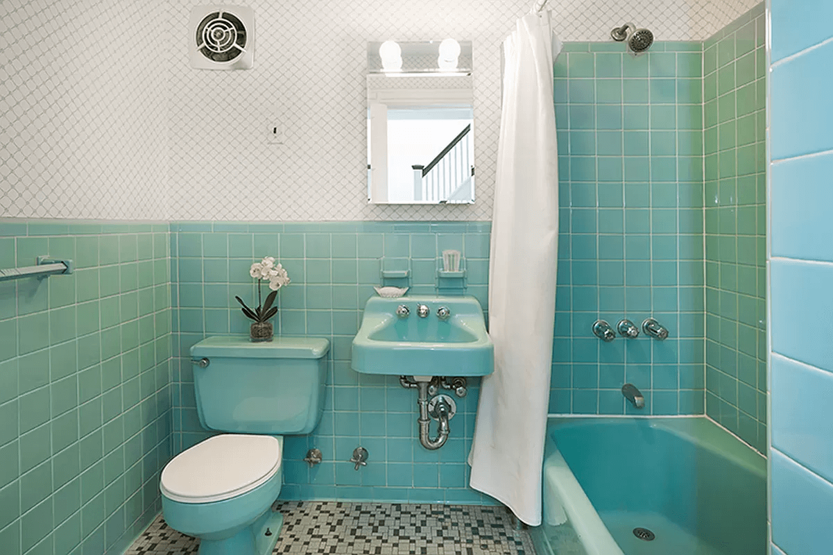 bathroom with green vintage tile walls and floor