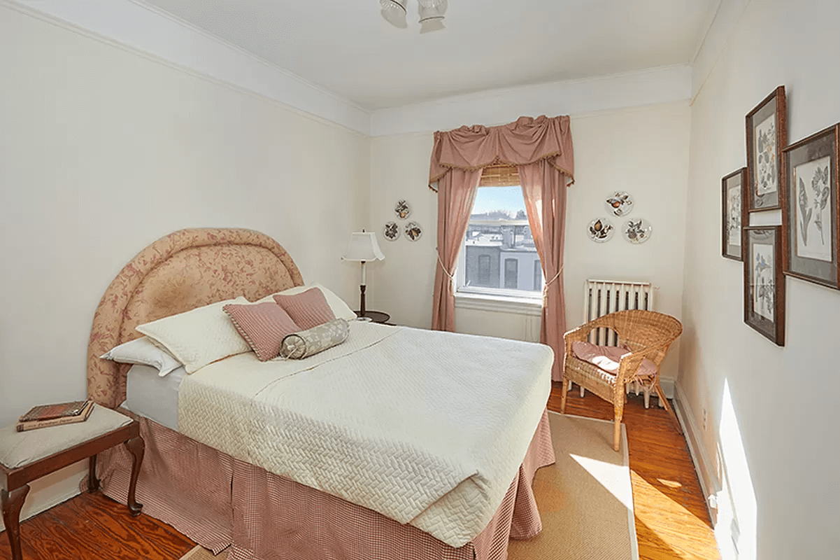 bedroom with wood floor and picture rails