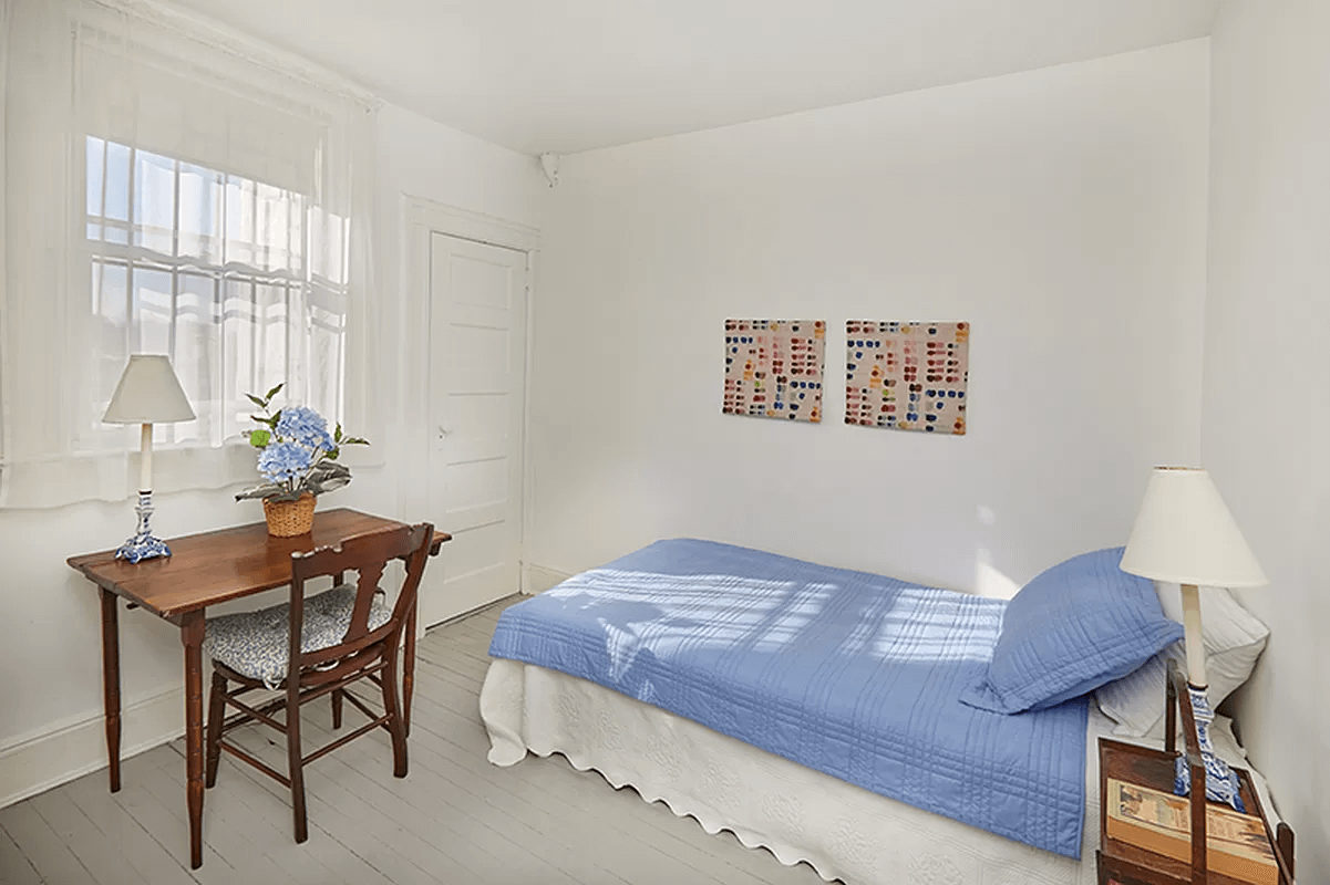 top level bedroom with door to toilet room