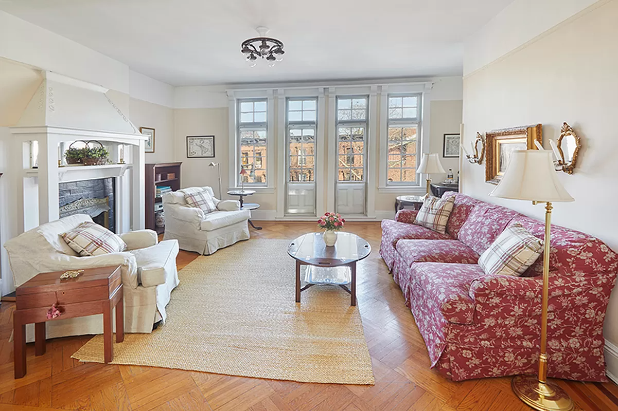 living room with mantel and picture rail