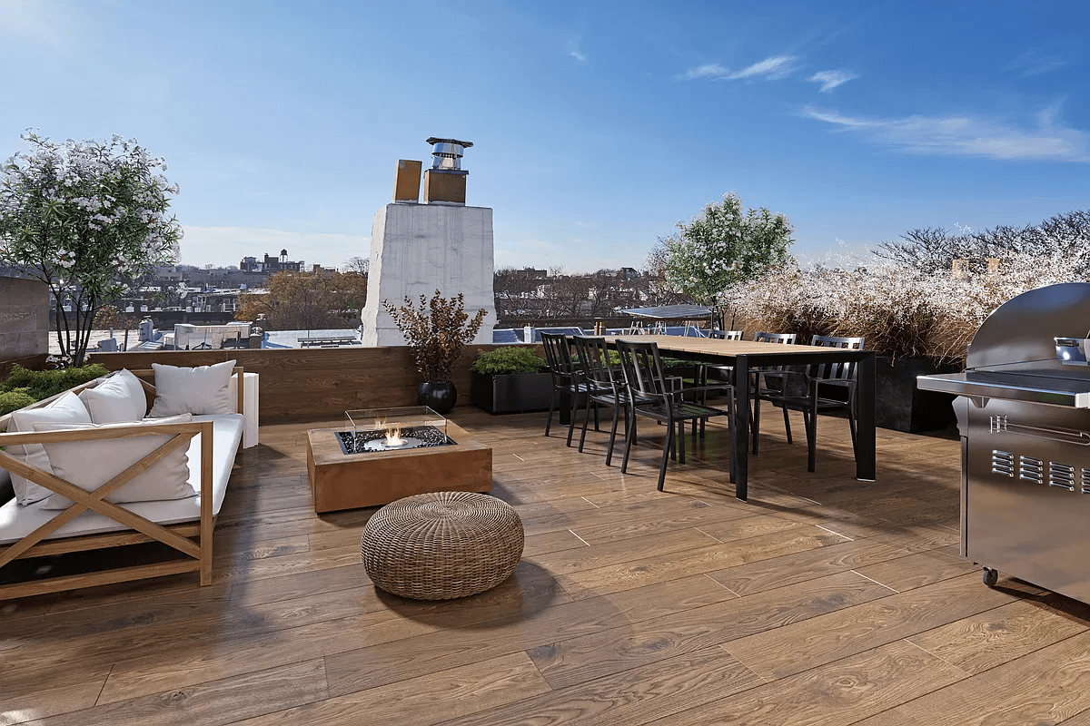 virtually staged roof with wood deck and dining area