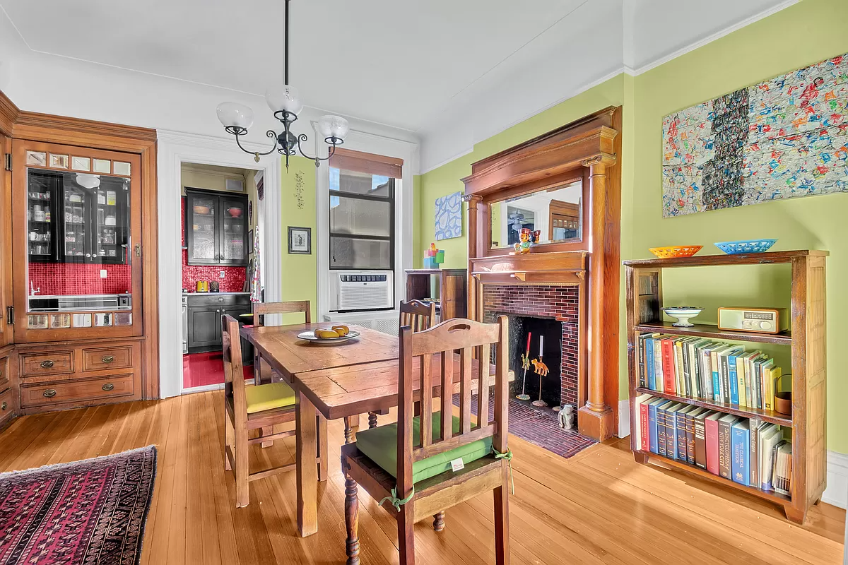 dining room with view into red kitchen