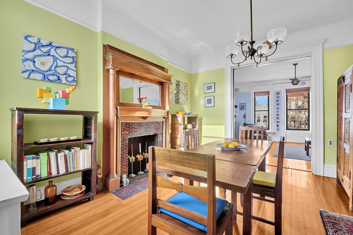 living room with columned mantel