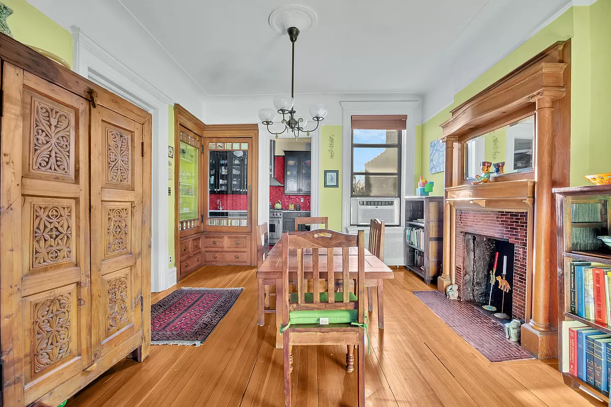 dining room with view into red kitchen