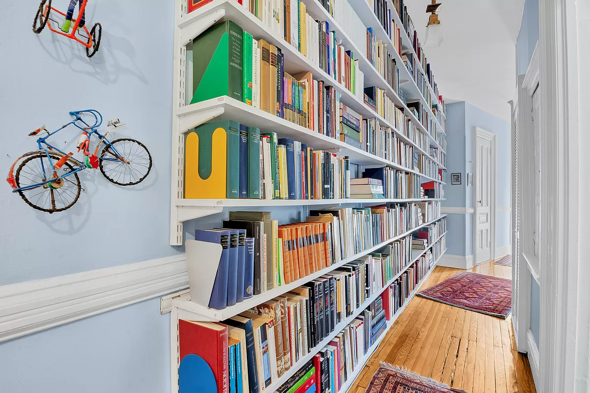 hallway lined with book shelves