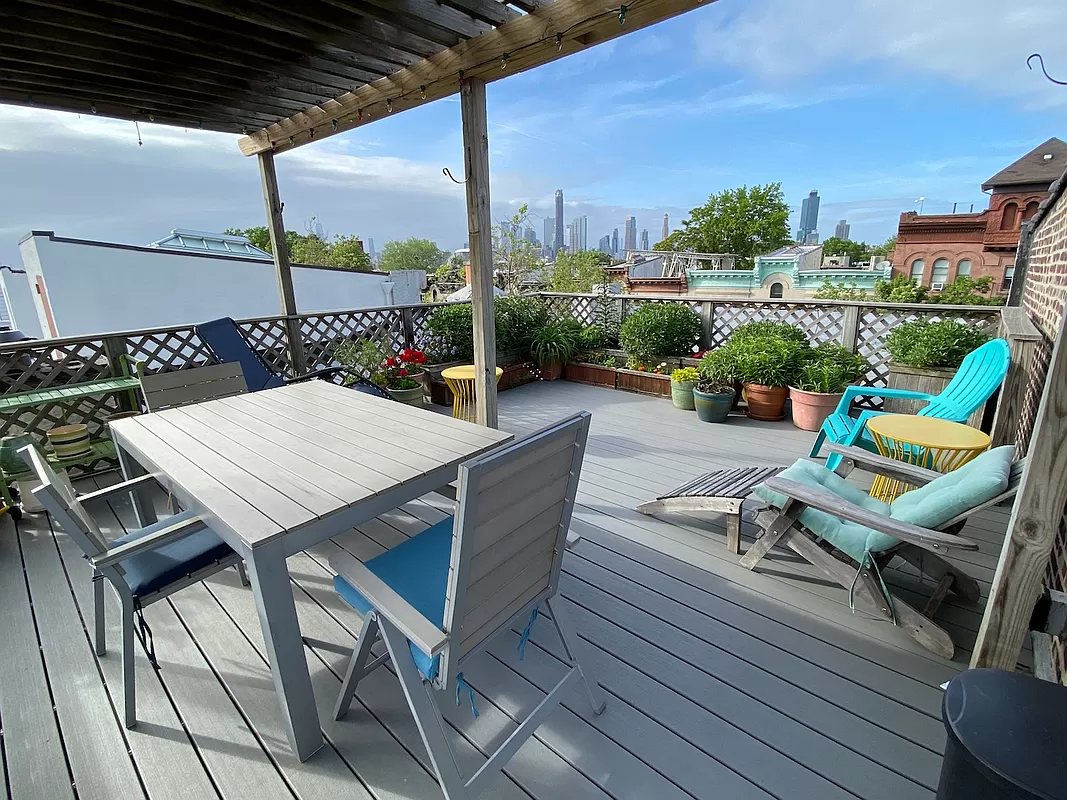 roof deck with lattice railing and room for dining