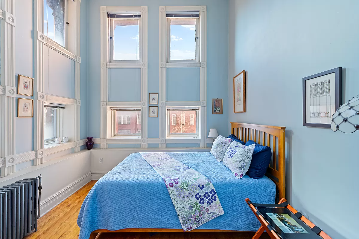 bedroom with two exposures and blue walls