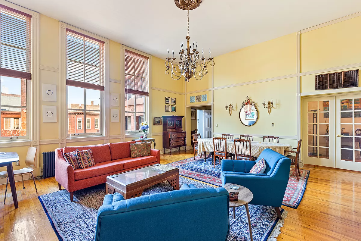 living room with high ceiling and wood floor