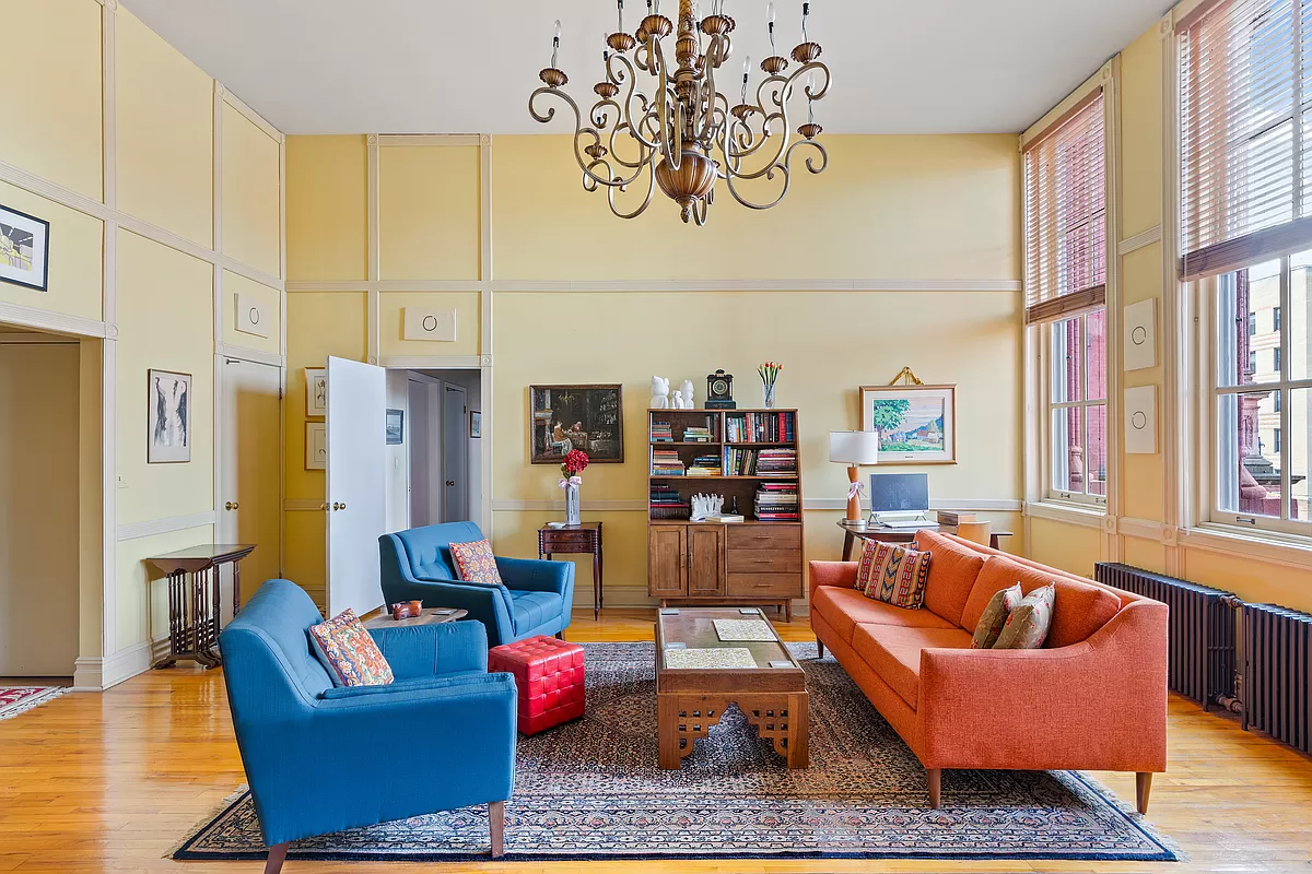 living room with tall windows and wood floor