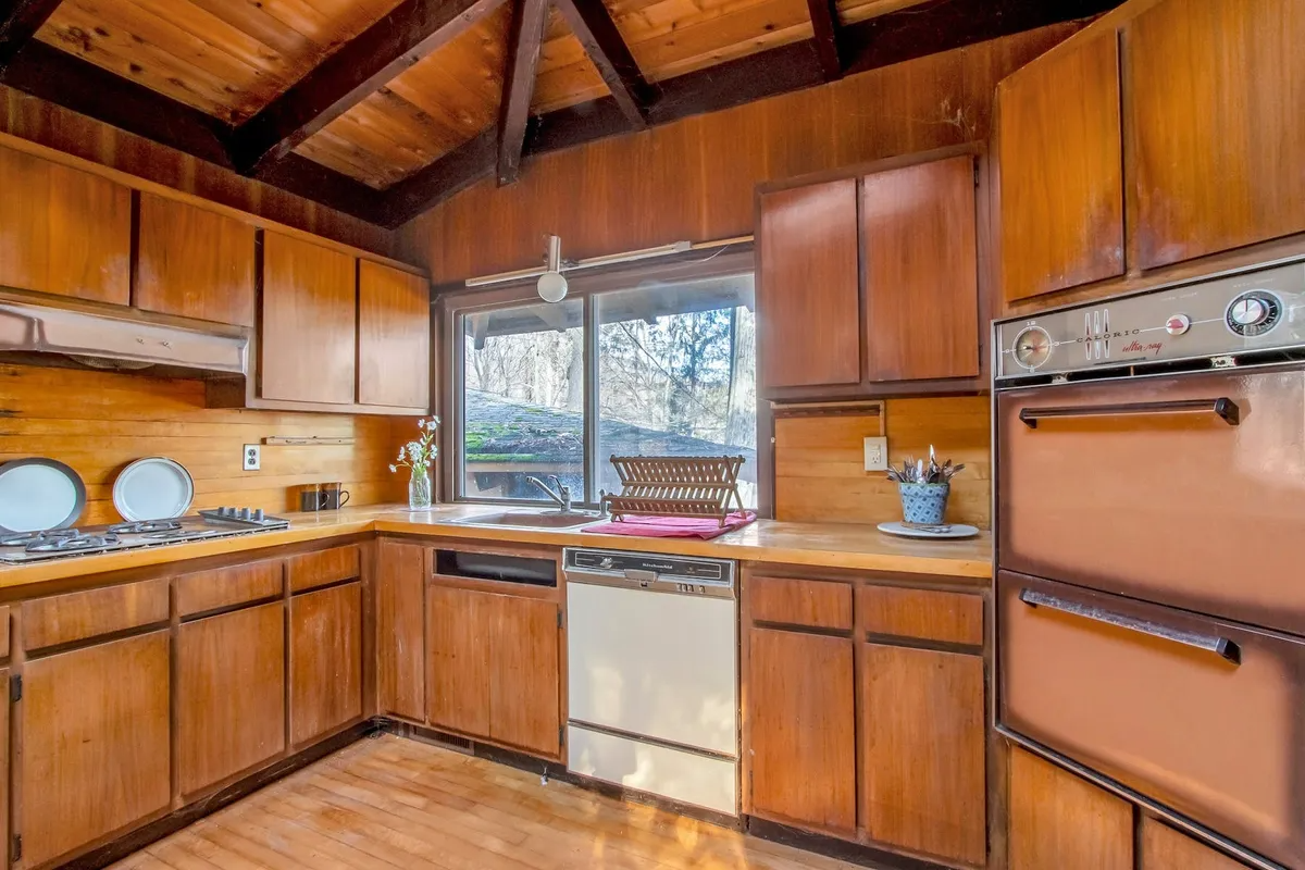 kitchen with wood cabinets and wood ceiling