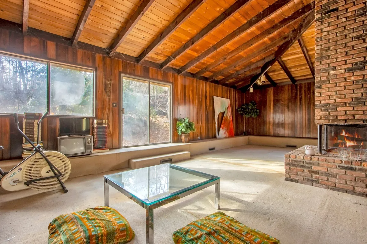 living room with step up to sliding doors to exterior