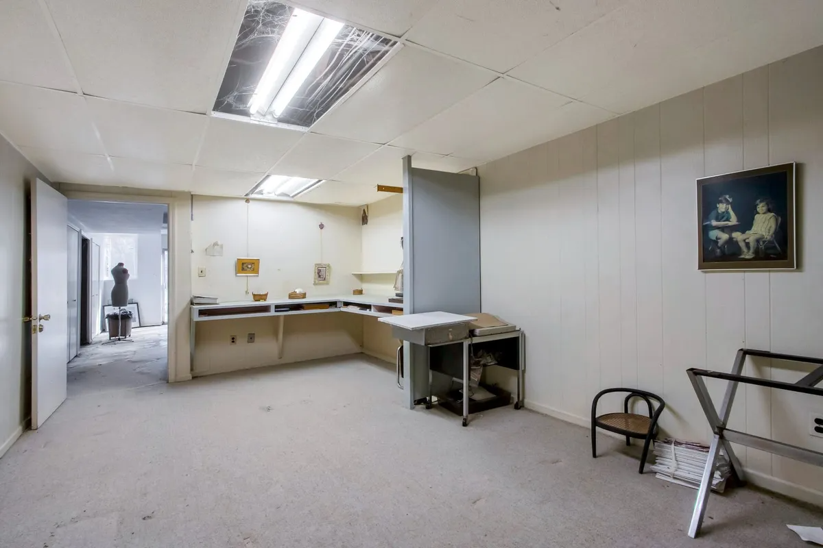 basement work space with dropped ceiling