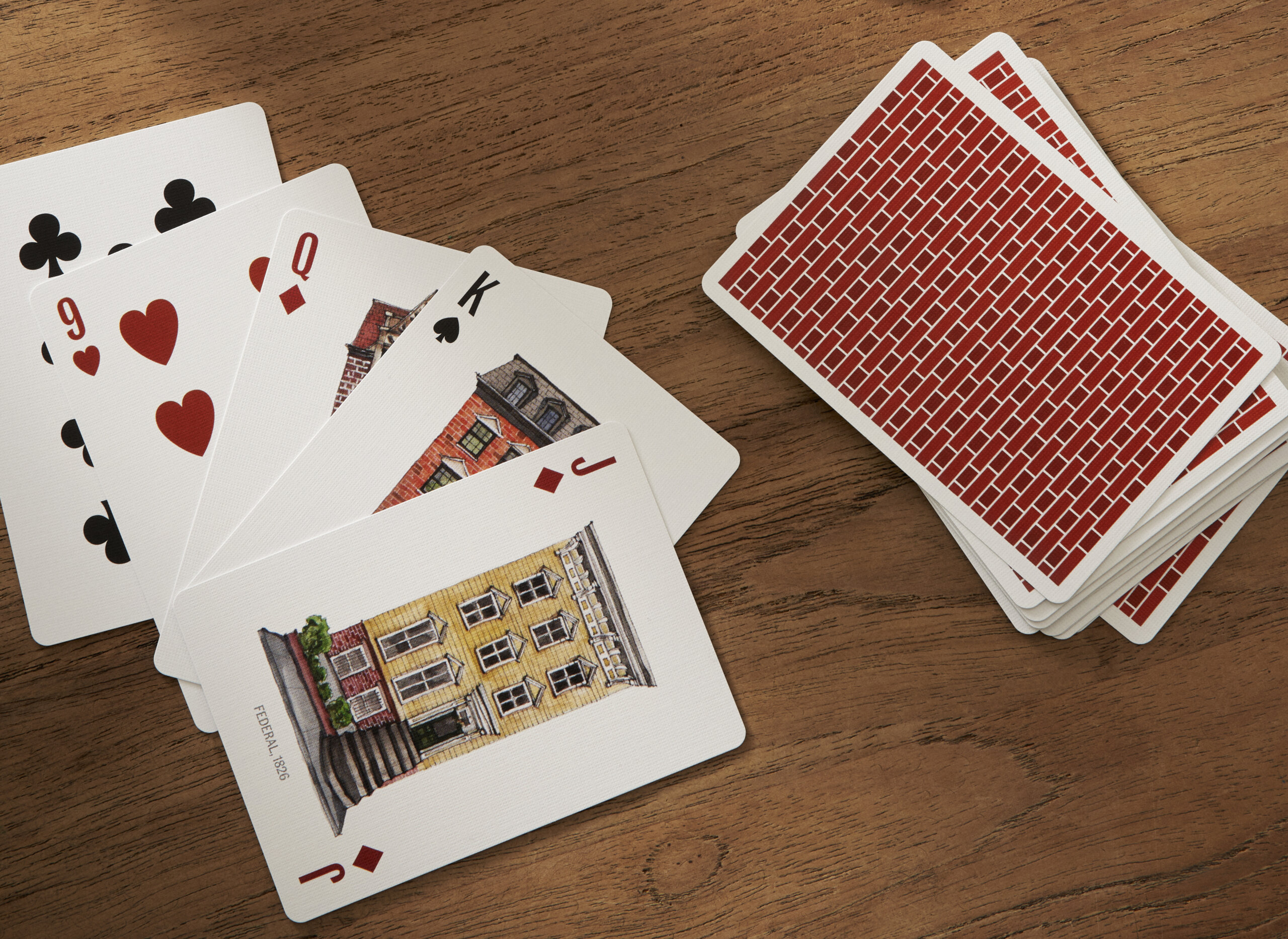 deck of playing cards with row house images
