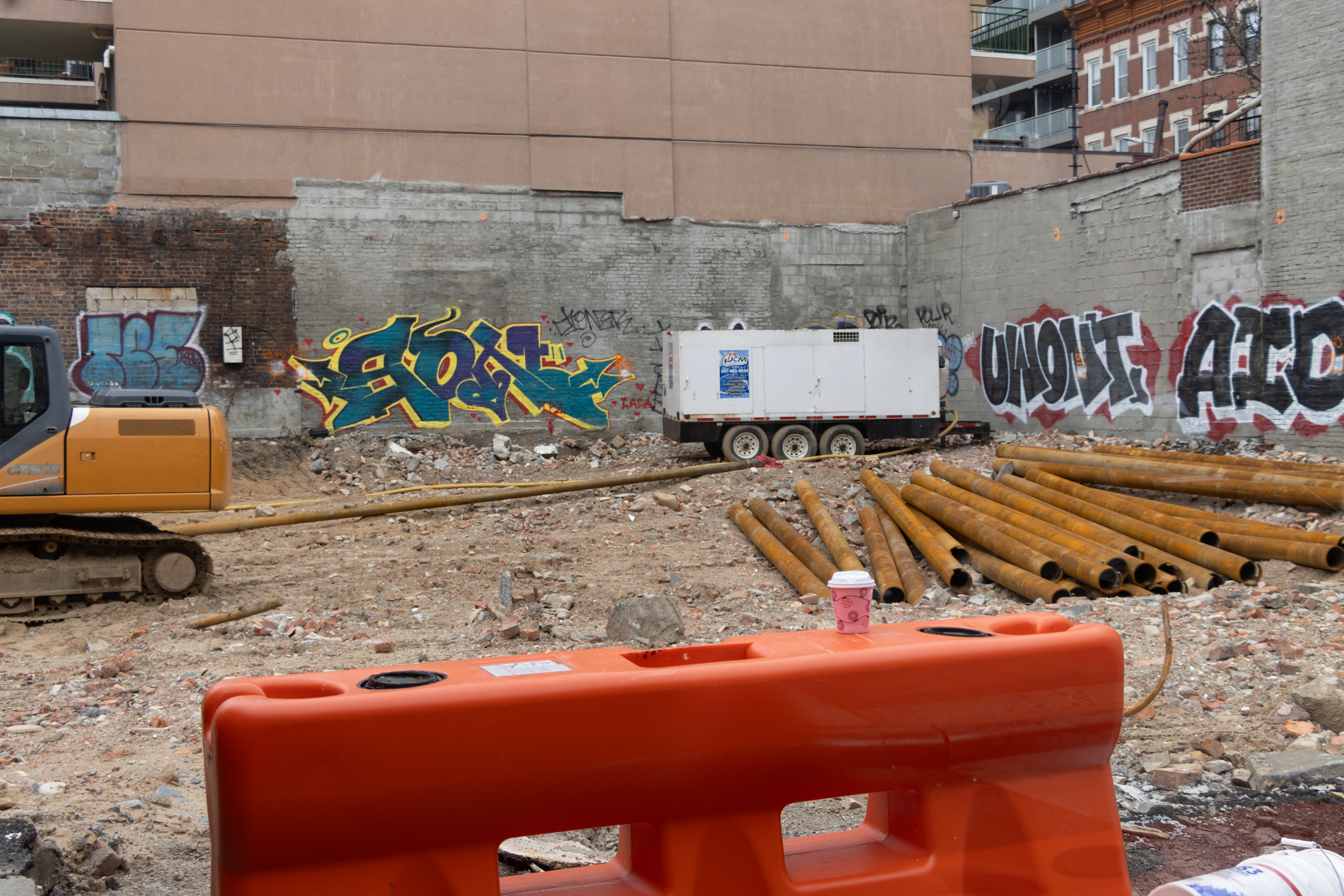 view inside the construction site with rubble and machinery