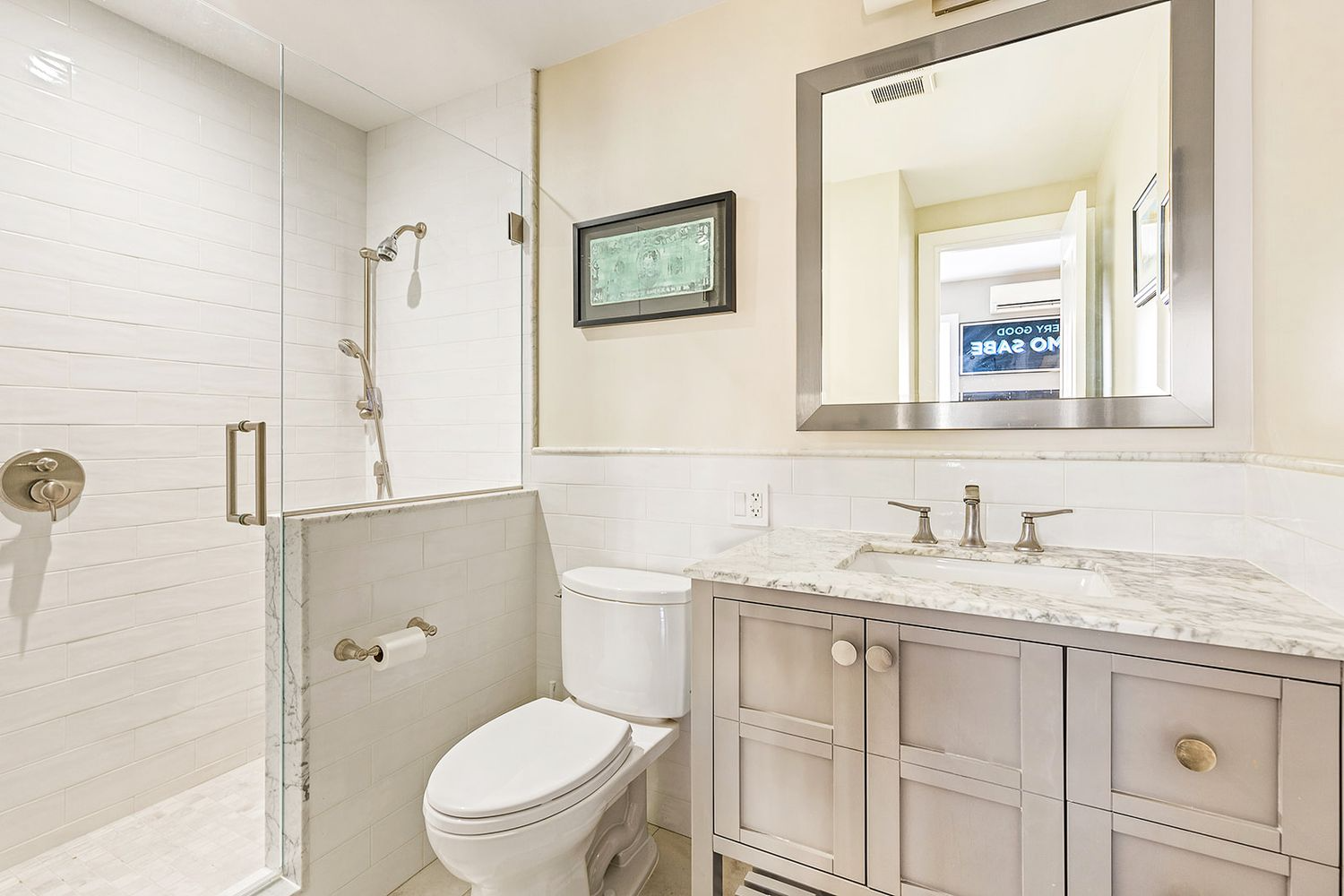 bathroom with shower and white subway tile
