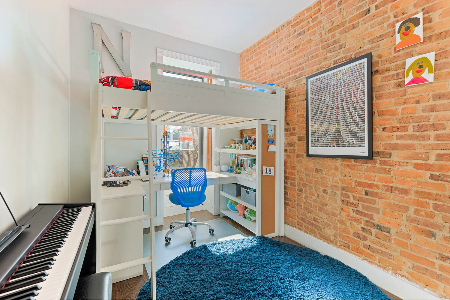 bedroom with exposed brick wall