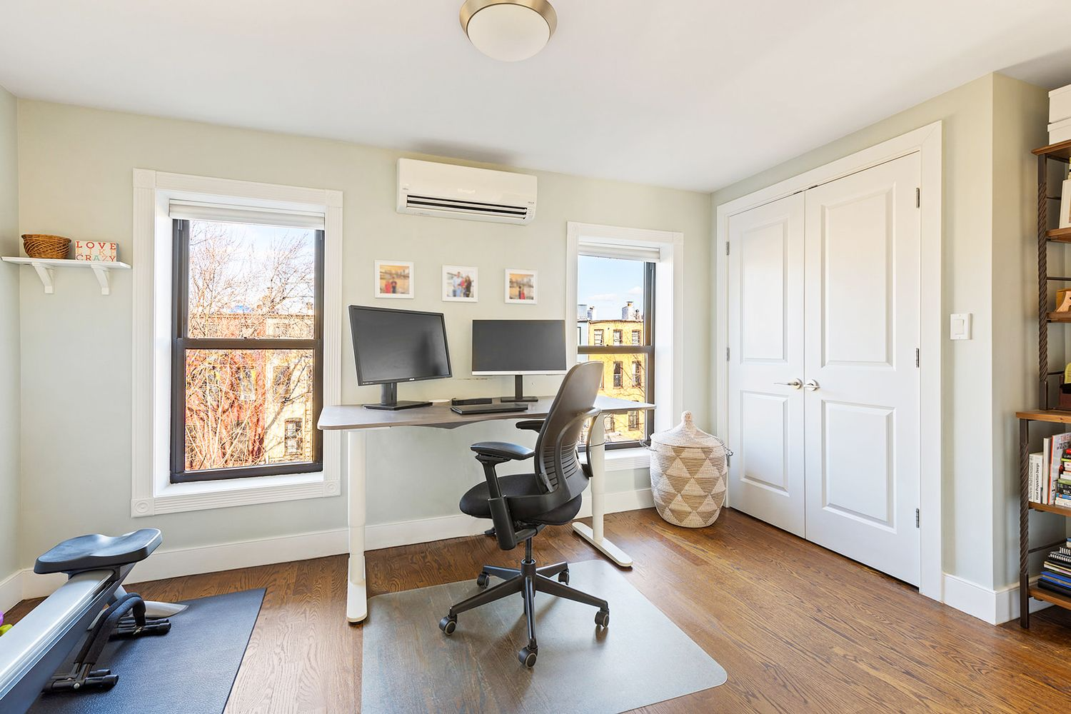 bedroom with two windows and a closet