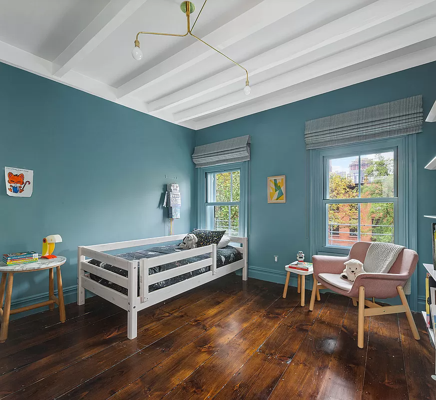 bedroom with exposed beams painted white