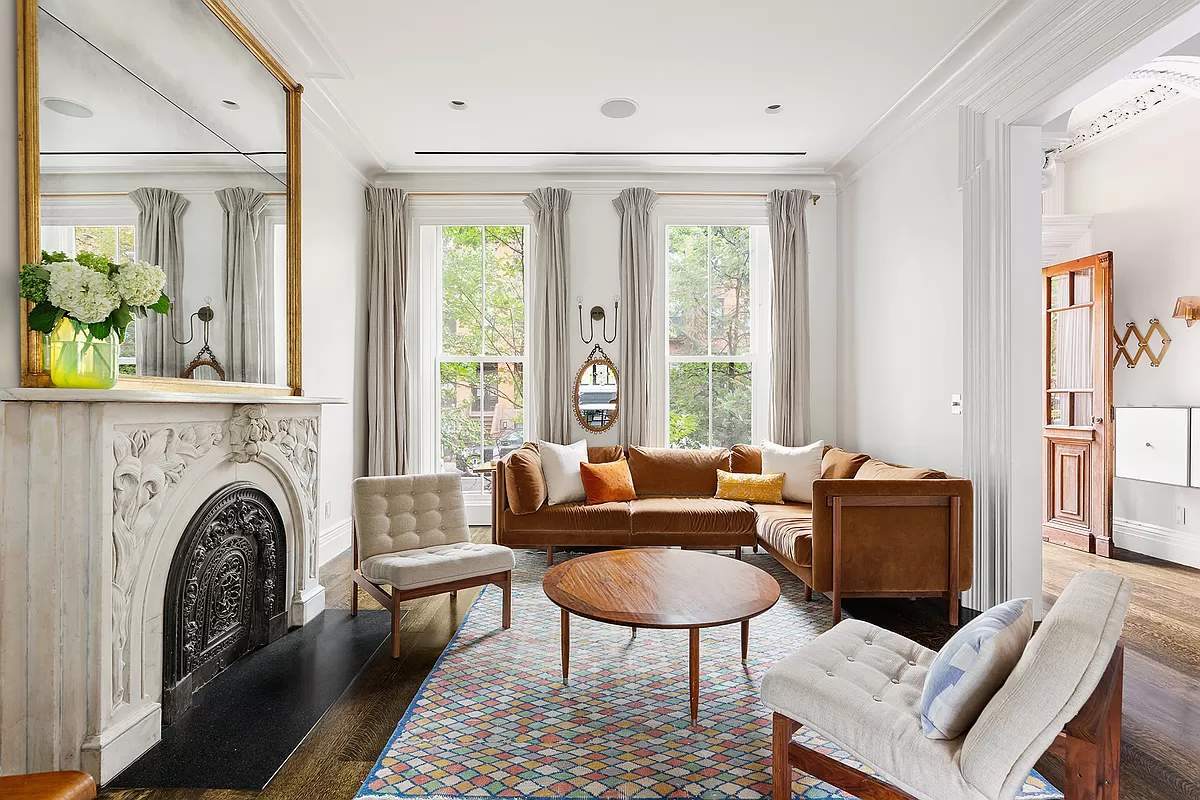 boerum hill - parlor with marble mantel and a glimpse of plasterwork in entry