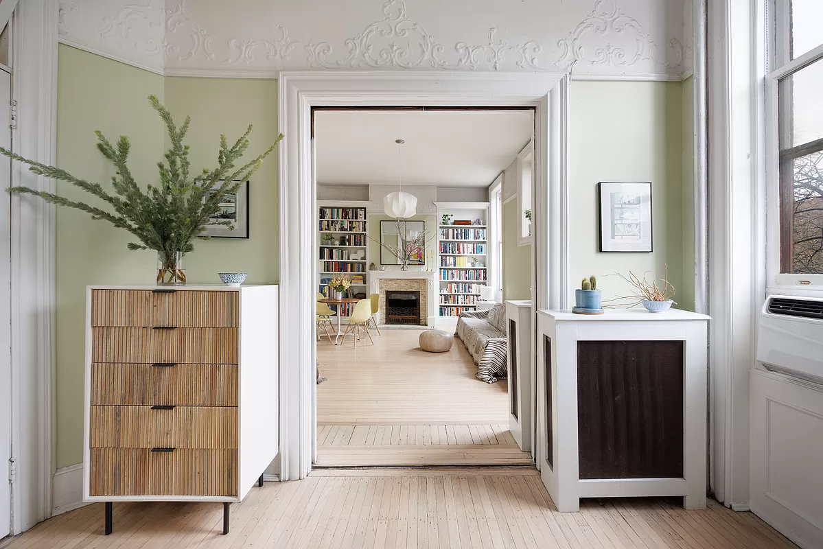 view into living room with plaster details