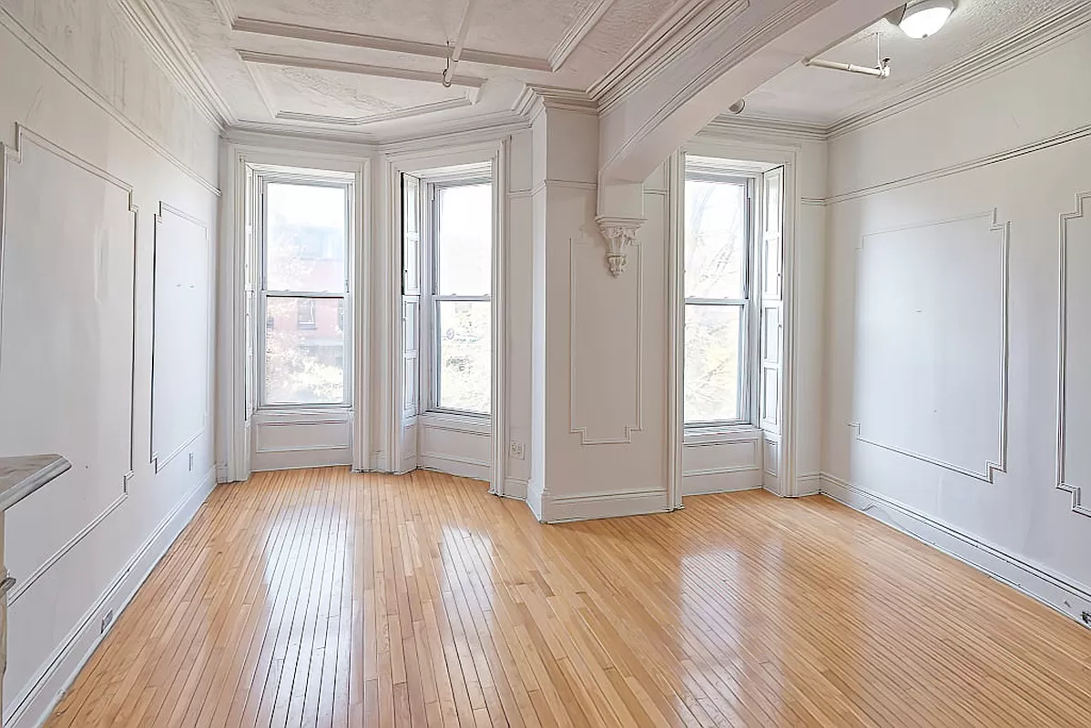 parlor with wall moldings and shutters