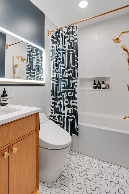 bathroom with white hex tile floor