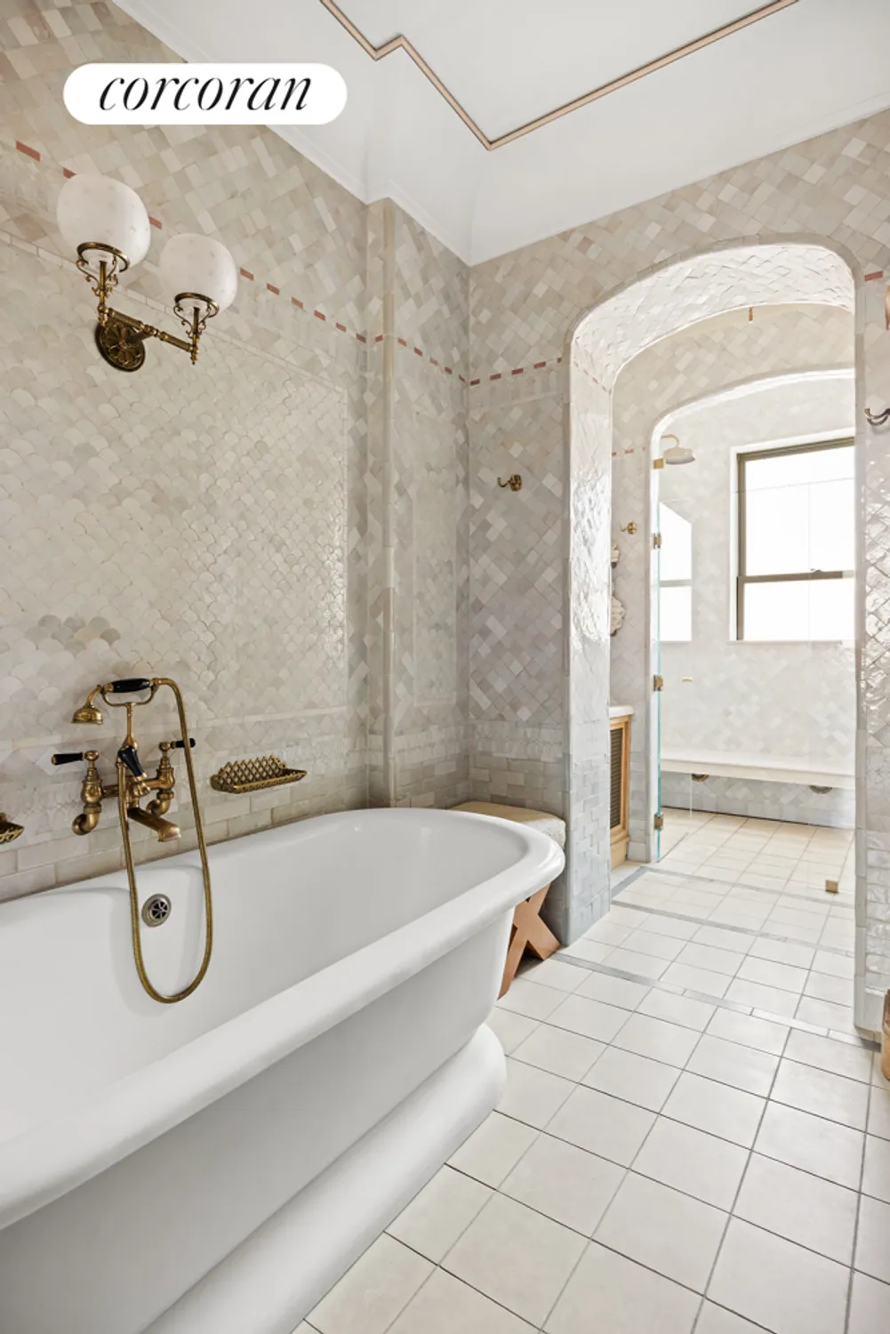 bathroom with beige tile on walls and a soaking tub