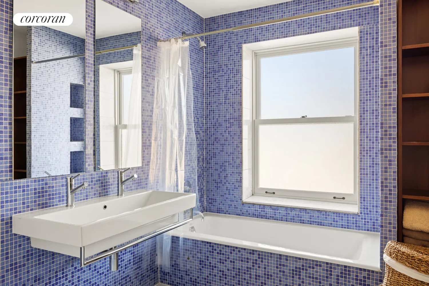 bathroom with blue mosaic tile on walls