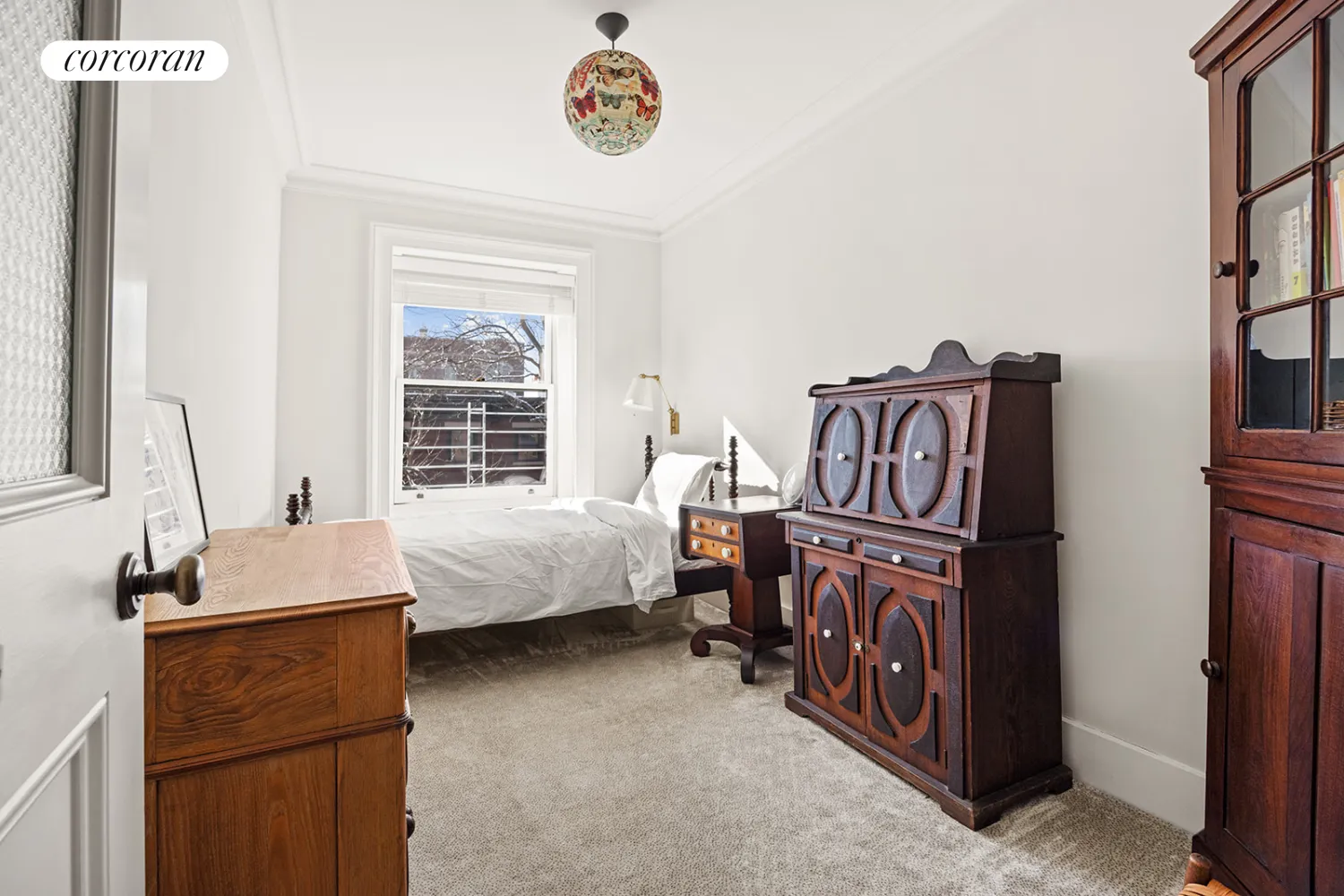 bedroom with beige carpet and white walls