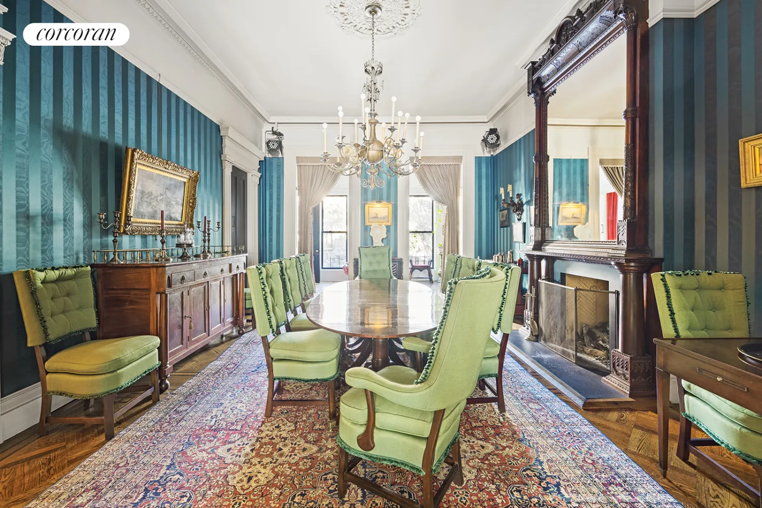 dining room with blue striped wallcovering and a mantel with over mirror