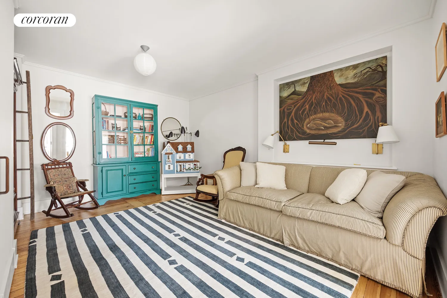 living room with white walls and wood floors