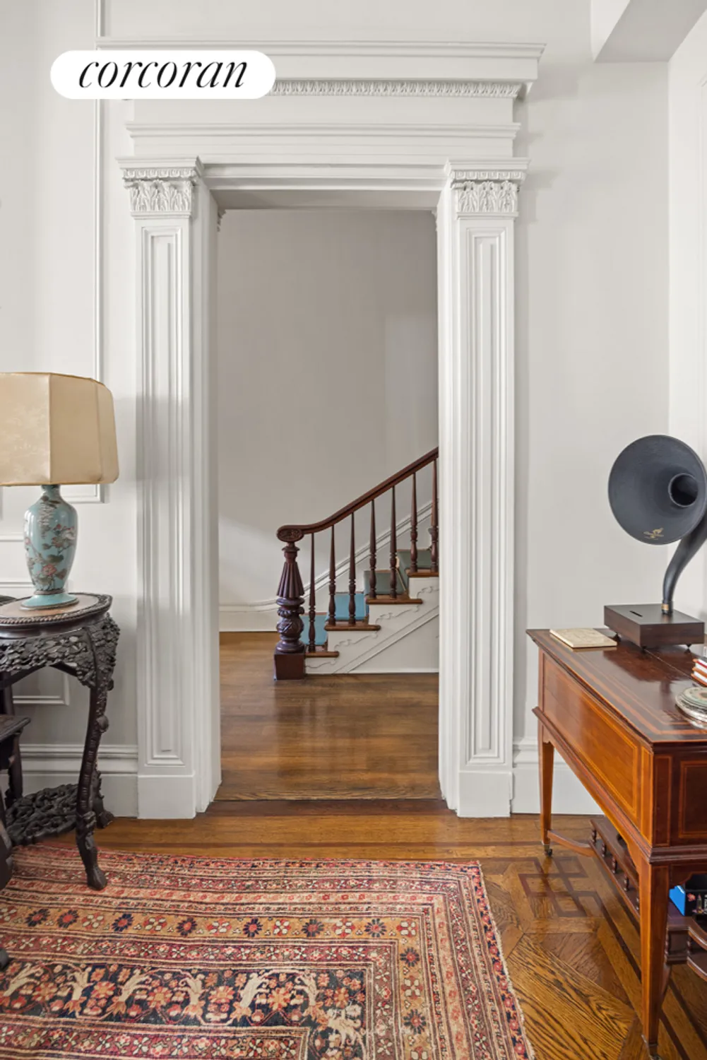 view from parlor to stair with newel post