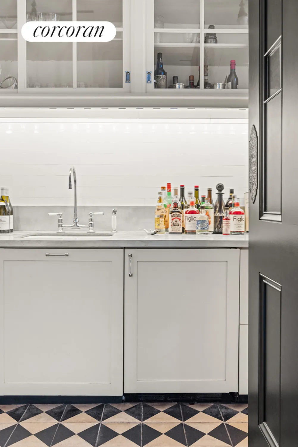 wet bar with black and white floor