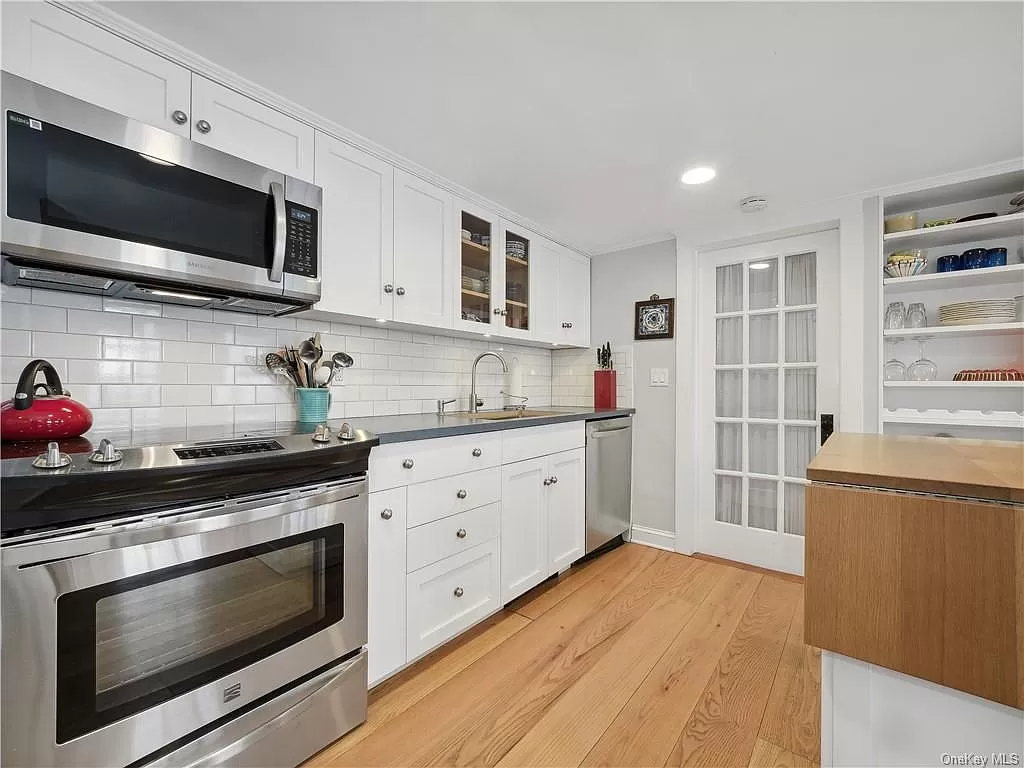 kitchen with white cabinets and wood floor