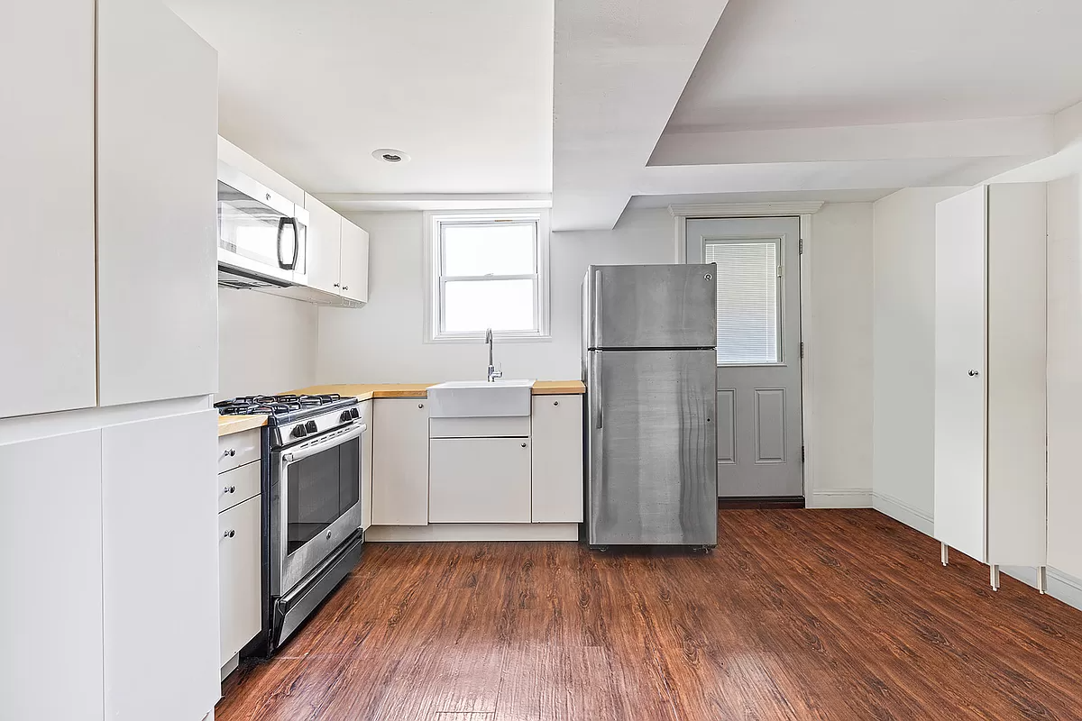 garden level kitchen with white cabinets