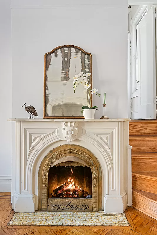 mantel next to a stair in the parlor