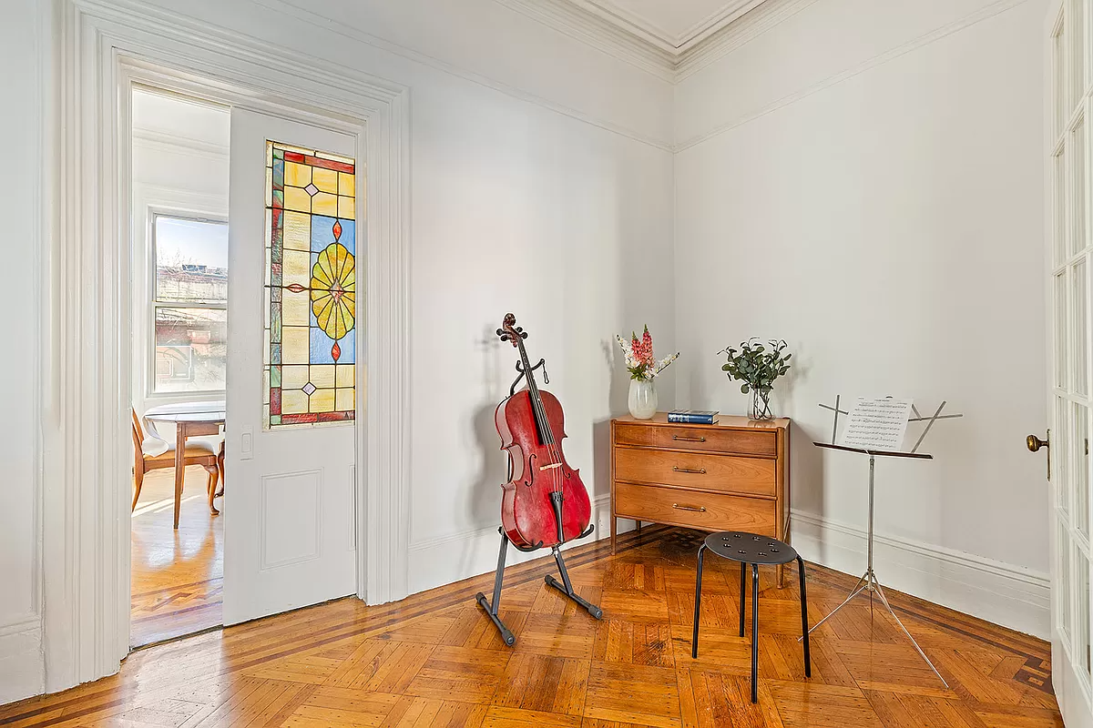 middle parlor with stained glass in pocket door