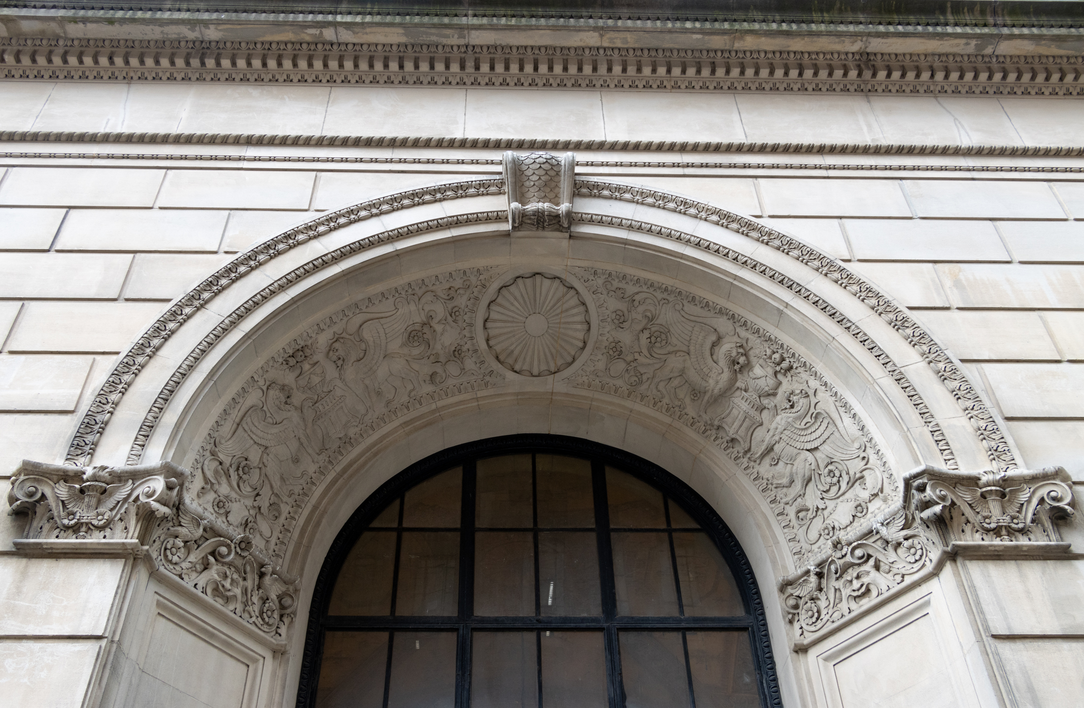 ornamental detail in a doorway with gryphons