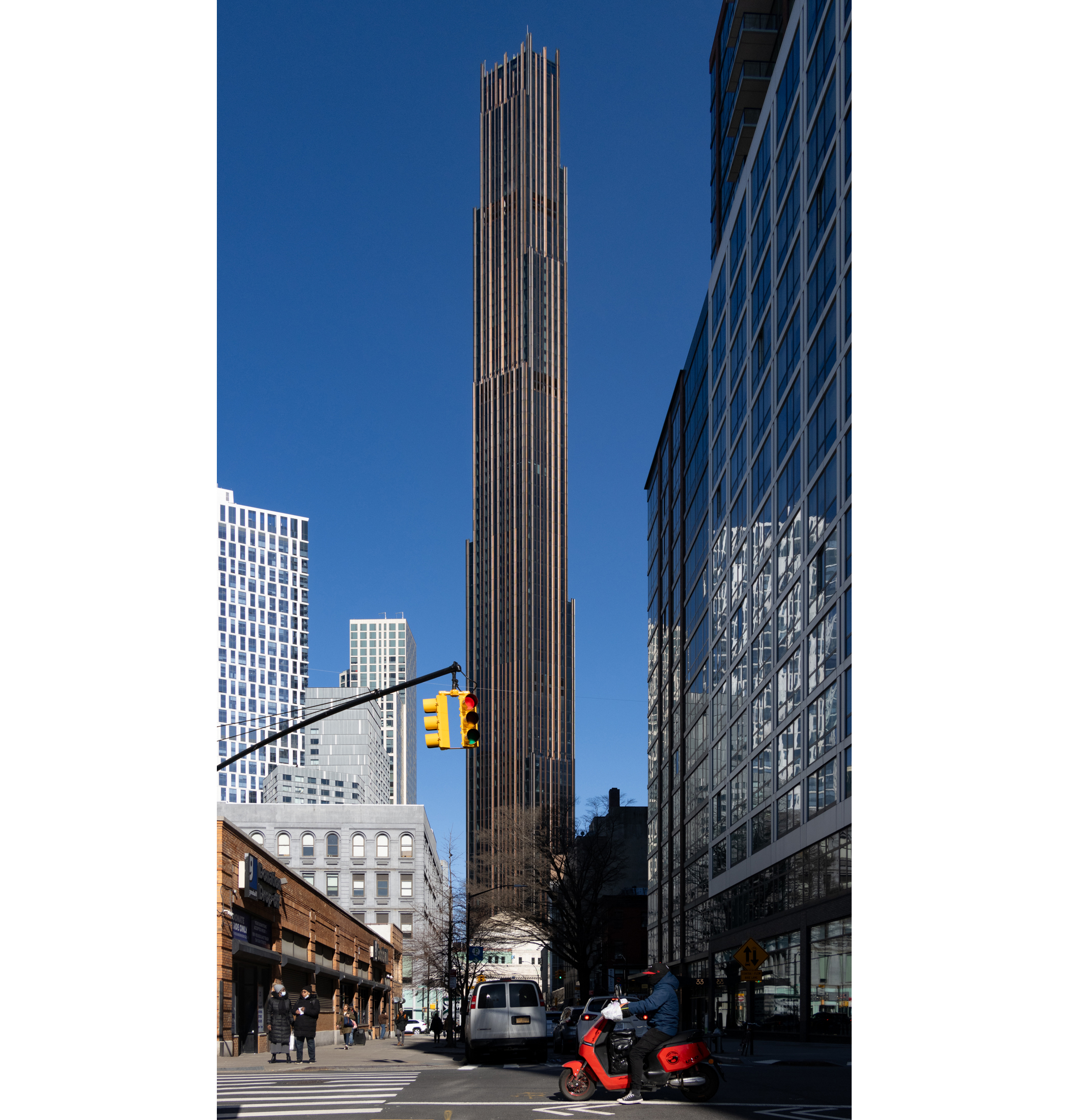 full tower looming above downtown brooklyn