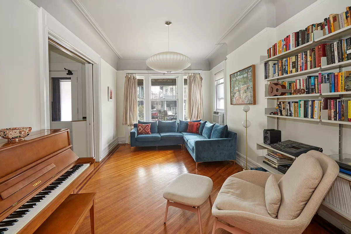 parlor with picture rail and wood floor