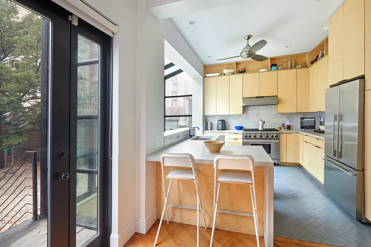 kitchen with wood cabinets modern windows