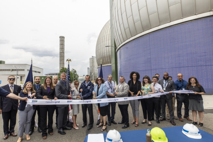 group cutting a ribbon