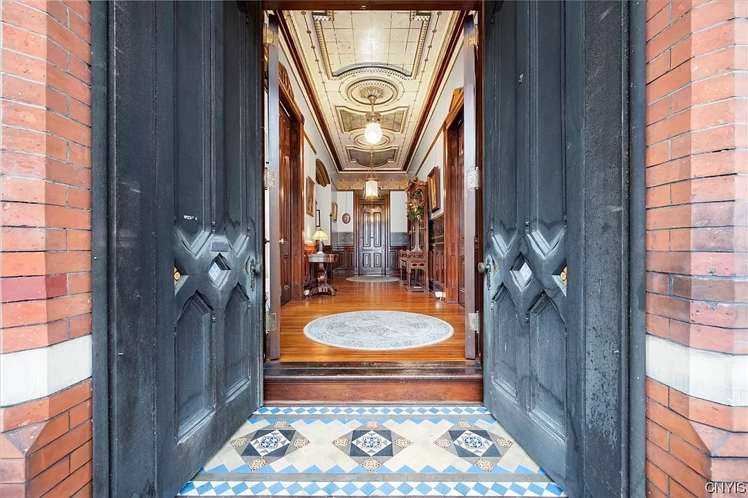 entrance with original tiles and glimpse into entry hall