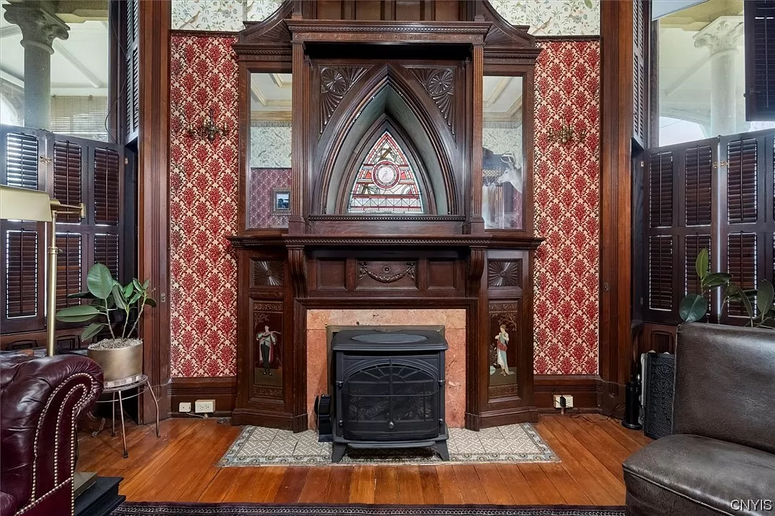 mantel with inlaid decorations, mirrors and later tile surround